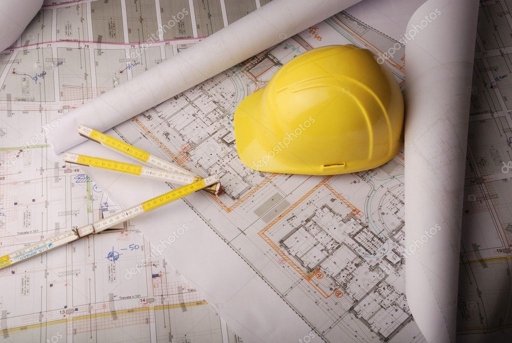 Security engineer reviewing system layout drawings