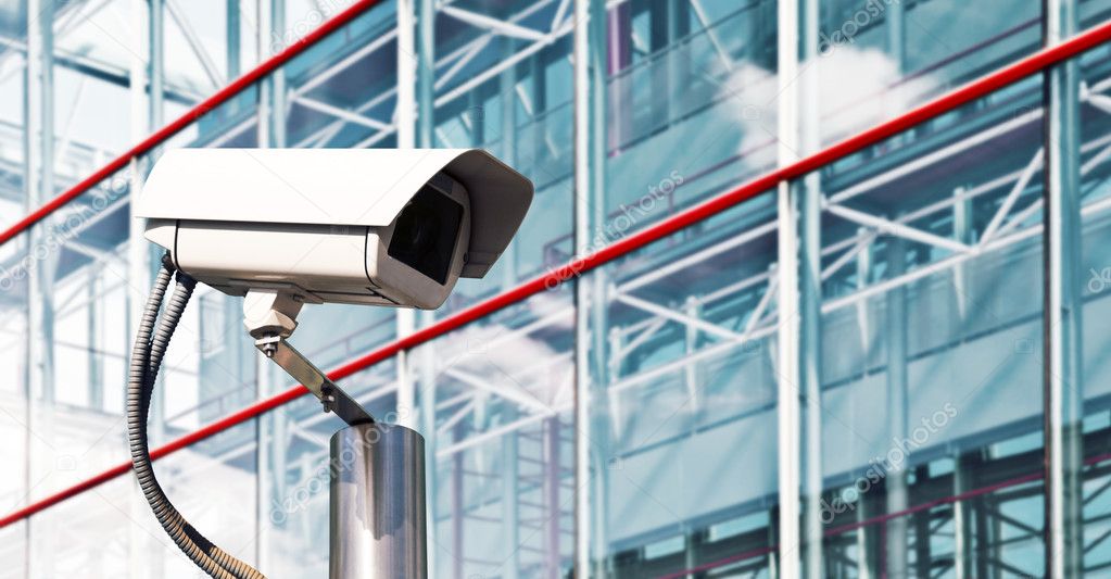 Office building lobby monitored by security cameras