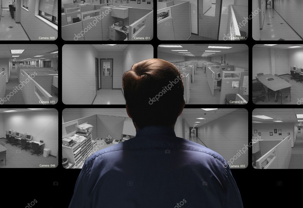 Security monitoring room with multiple surveillance screens