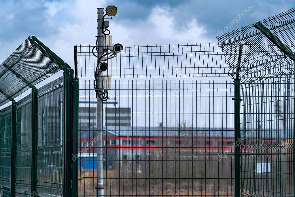 Security cameras overlooking a warehouse yard and loading bays